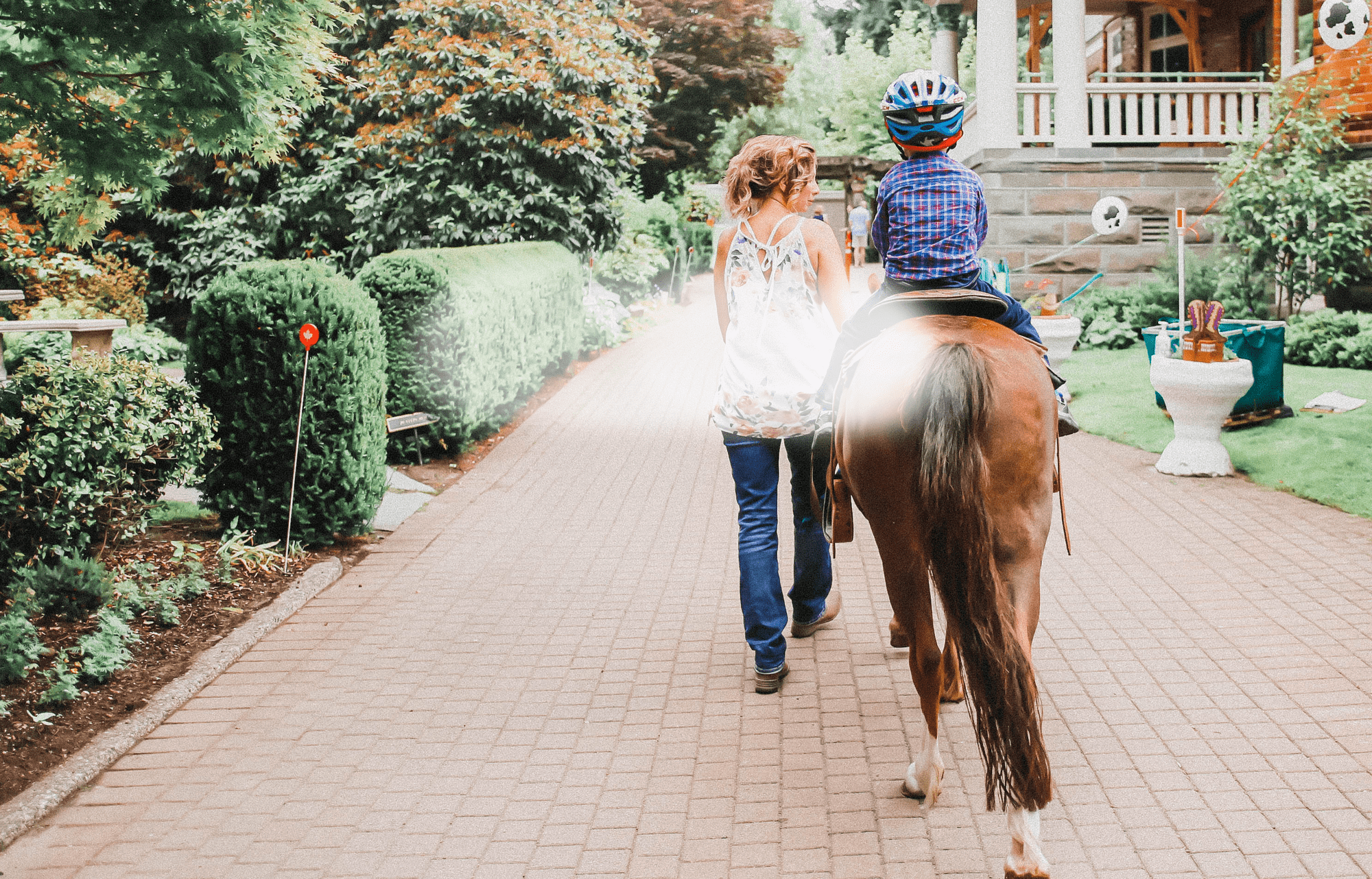 Canuck Place background image: Young Boy on a horse